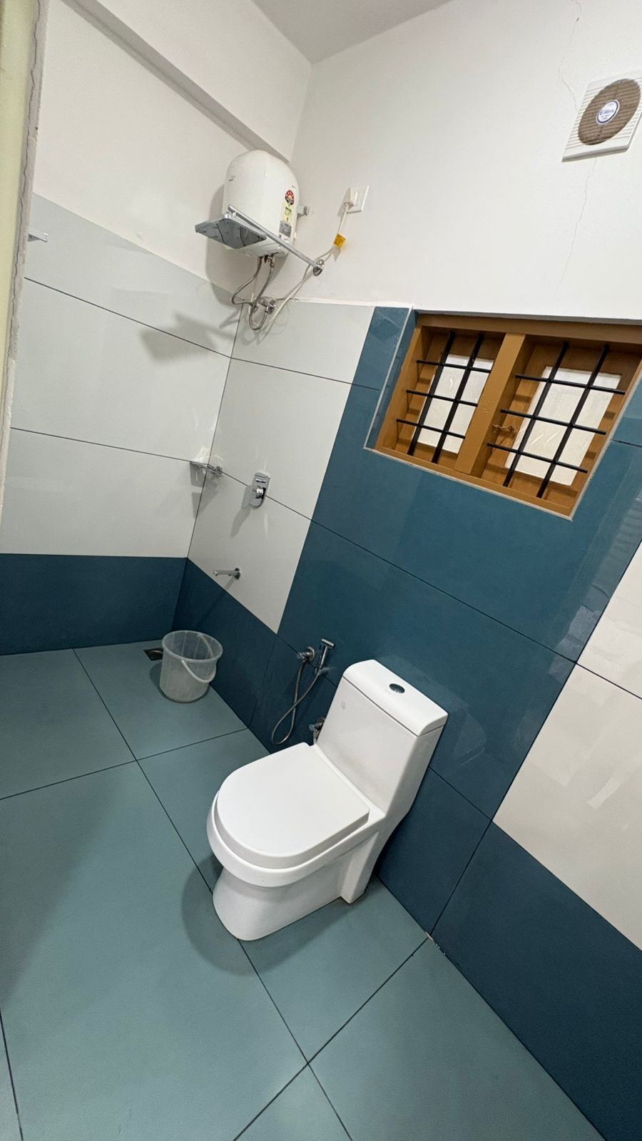 En-suite bathroom with geyser and shower