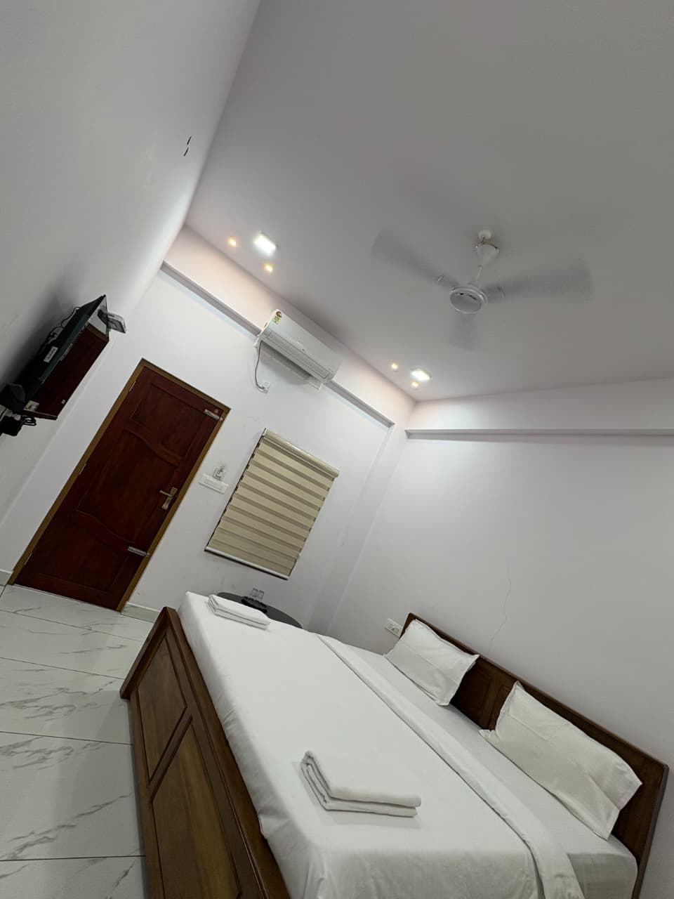 Family Room — air-conditioned room with double bed and window blinds